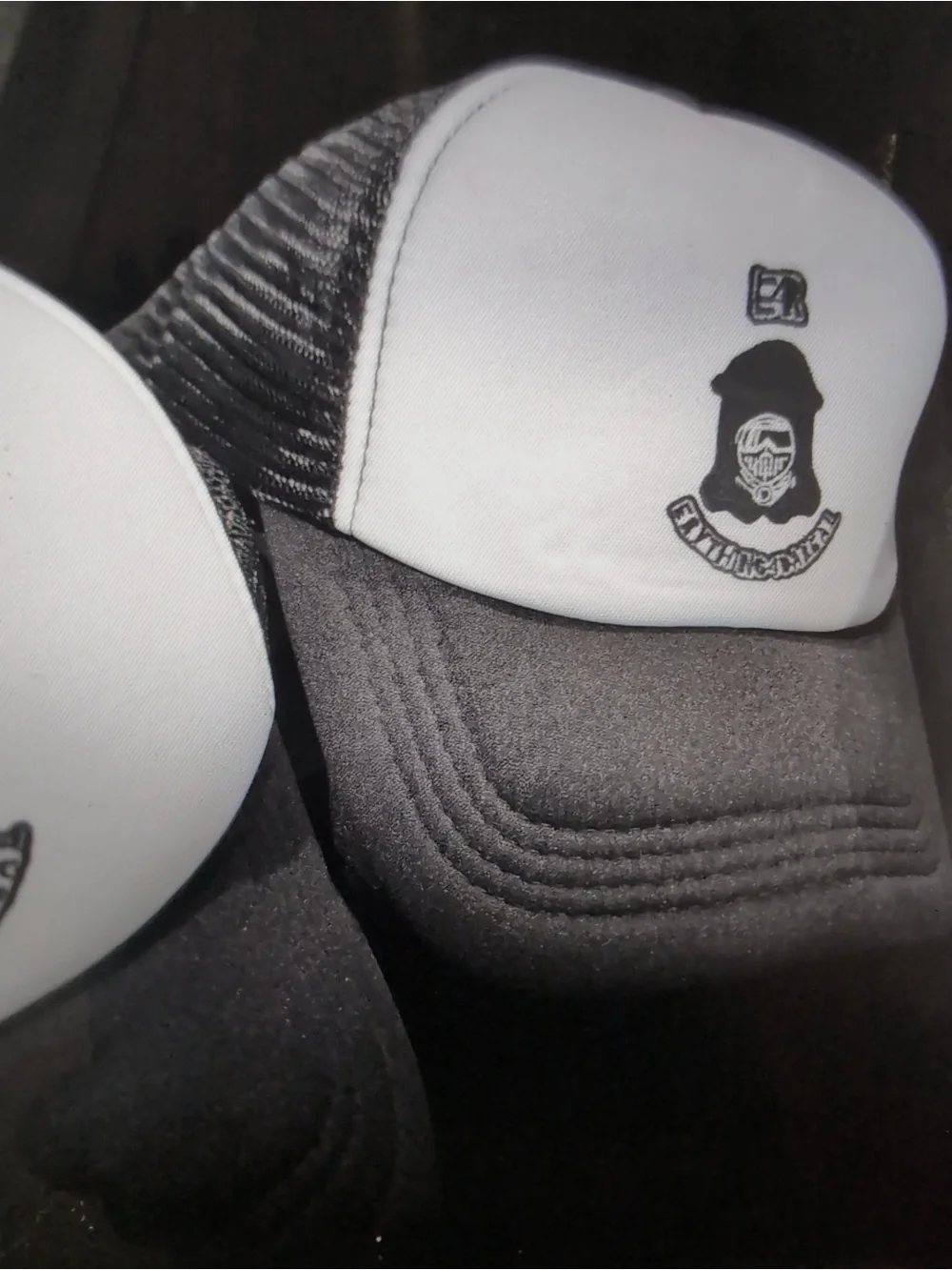 Black & White Trucker Cap with Embroidered Crest